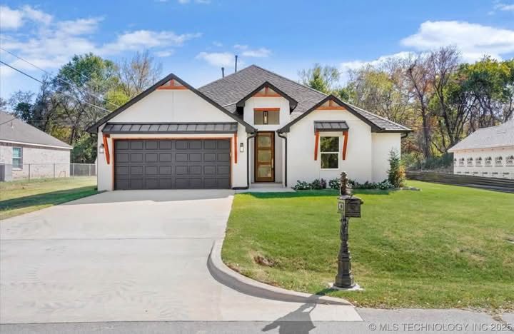 Completed single-story home with a white exterior, cedar trim accents, dark gray two-car garage door and new concrete driveway